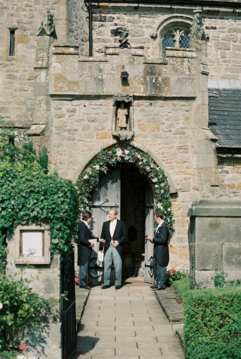 ushers in church doorway