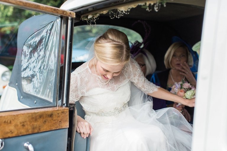 bride getting out of car