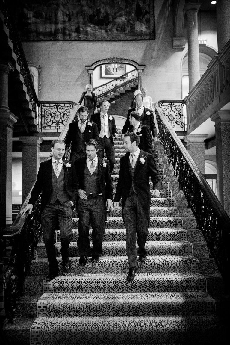groomsmen walking down staircase
