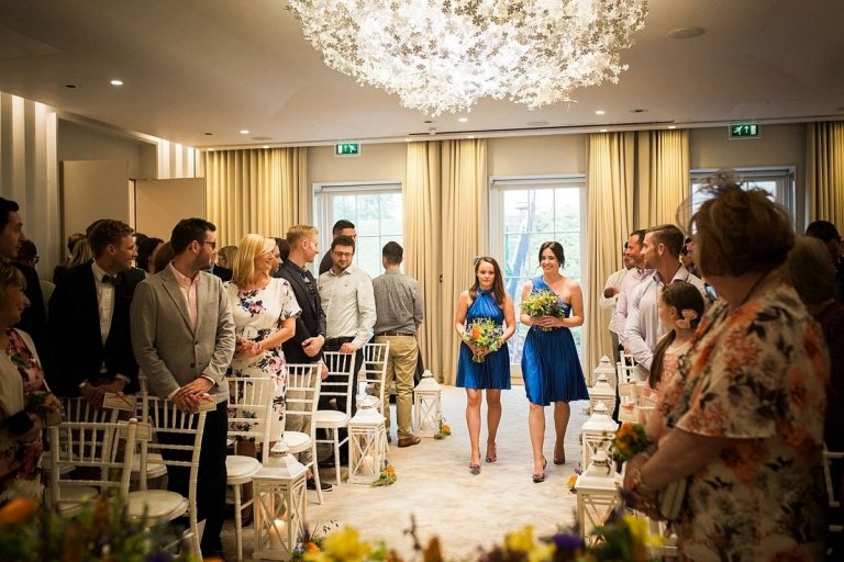 bridesmaids walking in ceremony